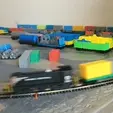 Intermodal_Flatcar_unload_and_load.gif N Scale Model Train Intermodal Flatcar Freight with Magnetic Loads Micro-Trains Couplers