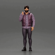 ezgif.com-gif-maker-3.gif man stands confidently wearing an open jacket with beard