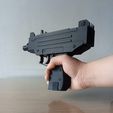 UZI-GIF-1.gif UZI Shell Ejecting Rubber Band Gun Scale 1:1