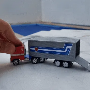 vv-2.gif Optimus Prime Hot Wheels Trailer Add-On | 1:64 Scale Matchbox Compatible | Porte arrière fonctionnelle + Rampe