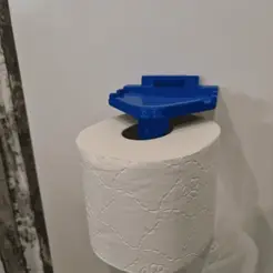 20231108_165950.gif Dispenser for toilet paper with shelf.