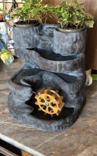 IMG_1218.gif Homemade waterfall with plants.