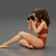 ezgif.com-gif-maker-9.gif Woman photographer in bikini sitting and holding a camera
