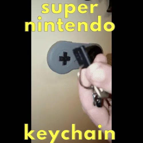 sc.gif SUPER NINTENDO KEYCHAIN AND HOLDER