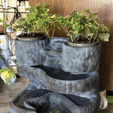 IMG_1218.gif Homemade waterfall with plants.