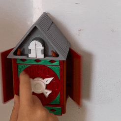 ezgif.com-gif-maker.gif STL file A wall clock with hidden doors and a bird coming out・3D printing design to download, ilankaplan84