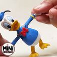 Comp_1_AdobeExpress.gif Donald Duck Articulated Toy.